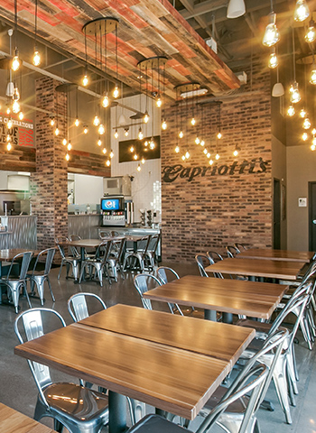 Capriotti's interior with hanging Edison lights